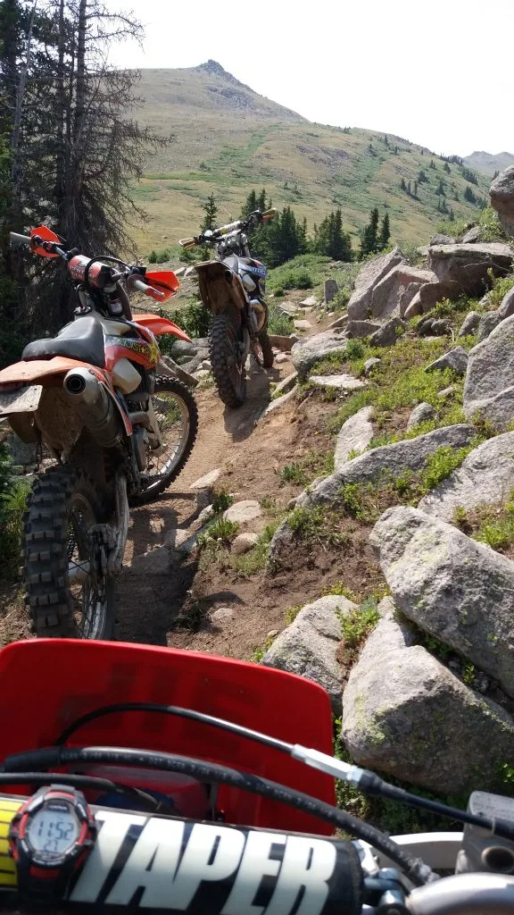 Riding dirt bikes on singletrack trails in the Colorado mountains