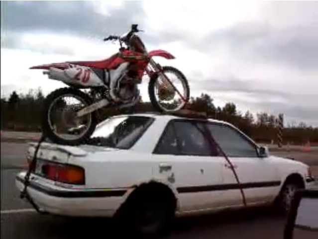 How NOT to transport a dirt bike on a car unless you like high risk scenarios