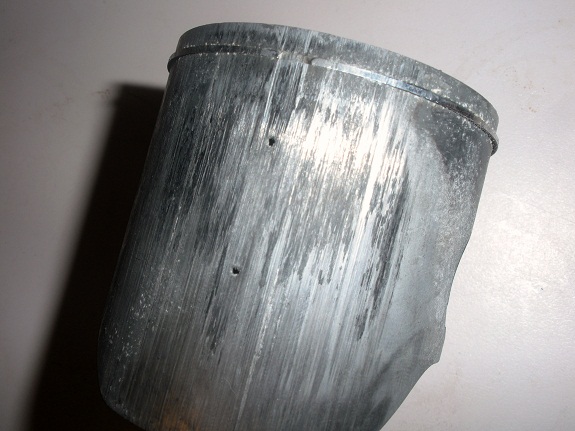 A 2 stroke piston that melted the piston and rings with major scoring