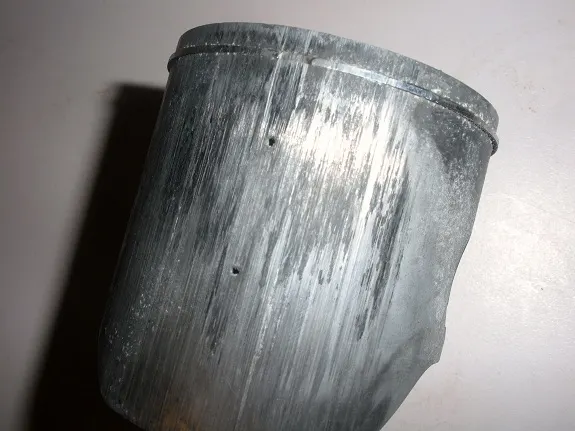 A 2 stroke piston that melted the piston and rings with major scoring