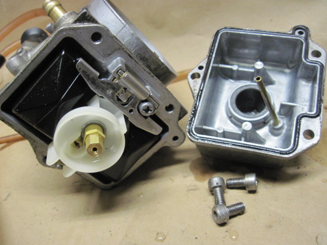 Adjusting the pilot jet on a dirt bike carb usually requires removing the float bowl.