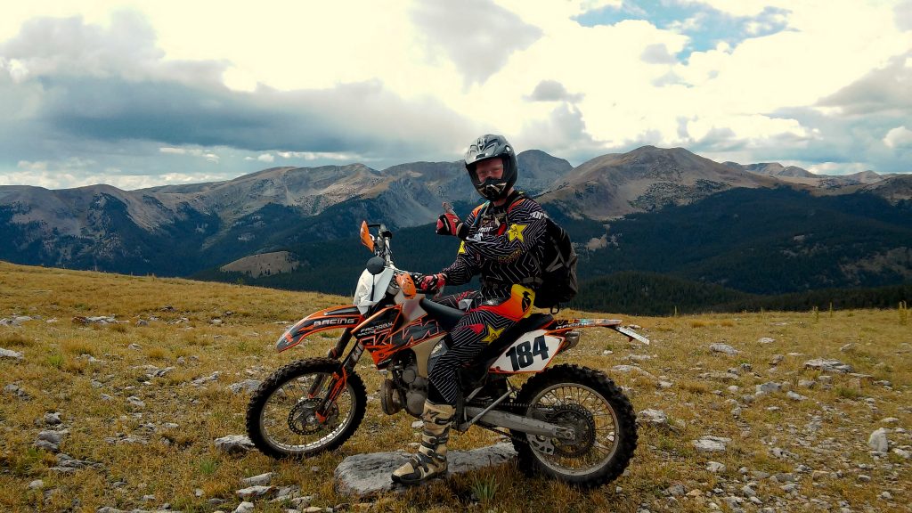 Sitting on a 2007 KTM 250 EXC 2 stroke enduro bike in the mountains of Colorado