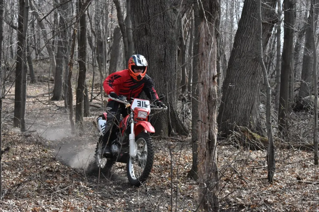 Using the correct attack position while standing on a dirt bike gives you the most control and confidence