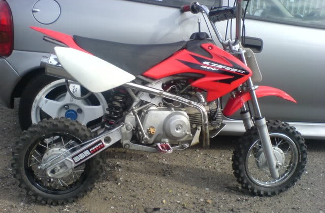 2005 Honda CRF50 with aftermarket suspension, exhaust, swingarm, tall seat, and upgraded foot pegs