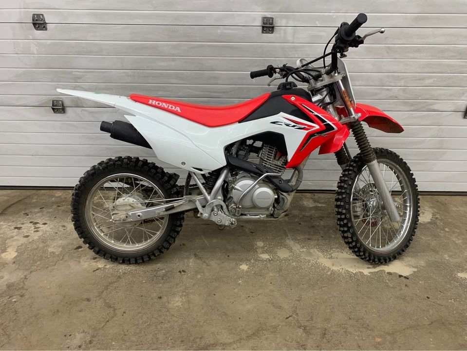 The CRF125F is a good dirt bike for a 12-13 year old teenager
