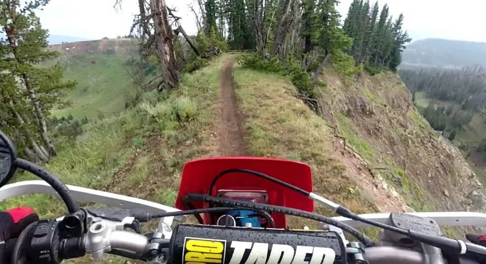 Riding on a ridge on a dirt bike trail