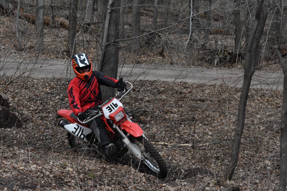 Using my leg while cornering on a single track dirt bike trail