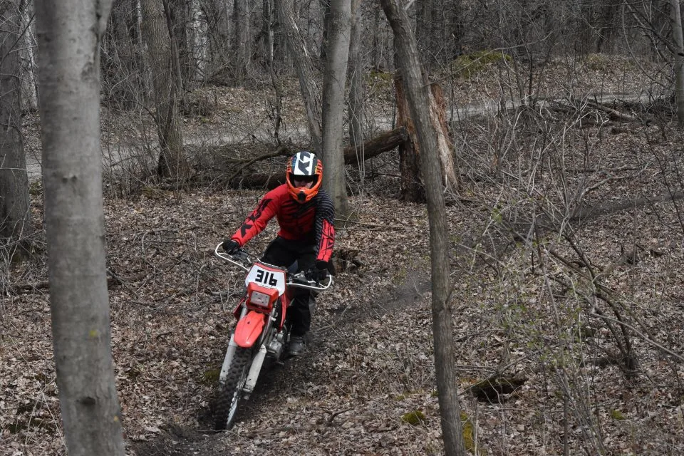 Using my legs as suspension on the dirt bike trail