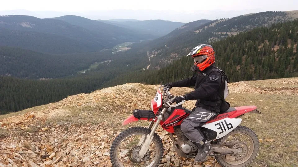 Wearing full riding gear on a dual sport ride in the mountains