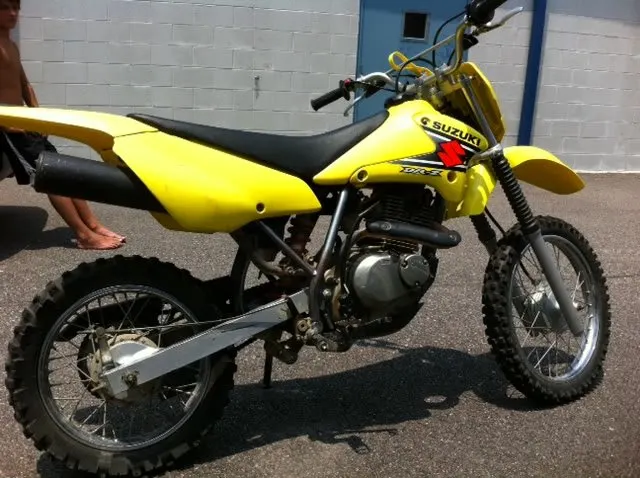 The Suzuki DRZ 125 is a basic 125cc 4 stroke. It's a great beginner bike to learn the clutch on.