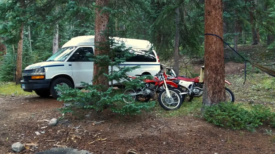 What vehicles can fit a dirt bike? A Chevy Express van without bench seats is a very popular and economical choice.