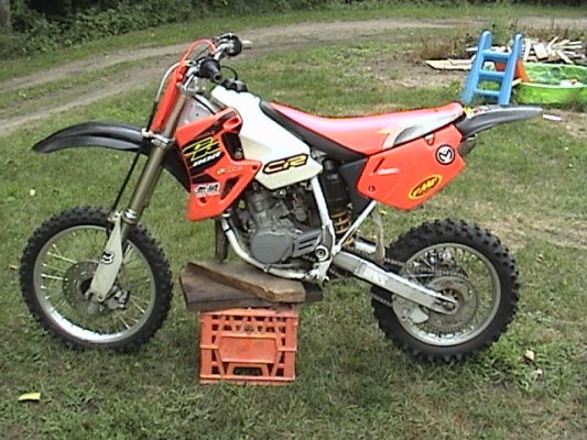 2000 Honda CR80 sitting on a milk crate stand