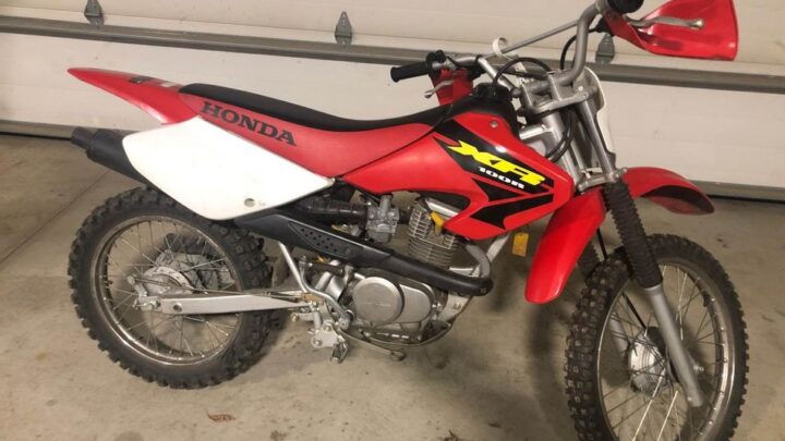 A stock 2003 Honda XR100R 4 stroke trail bike for beginners and casual riders