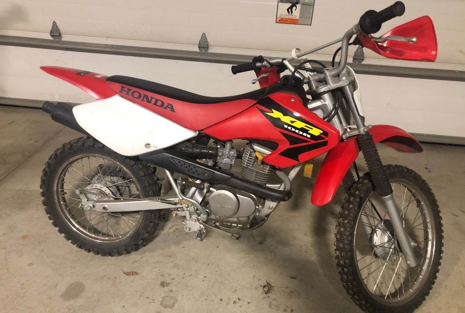 A stock 2003 Honda XR100R 4 stroke trail bike for beginners and casual riders