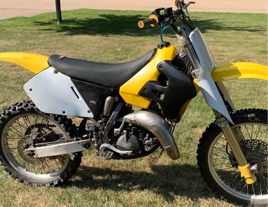 1996 Suzuki RM125 MX bike with right-side-up forks and fork guards
