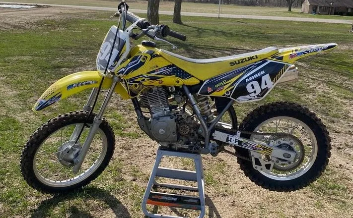 2004 Suzuki DRZ 125 four stroke trail bike with an aftermarket Yoshimura exhaust