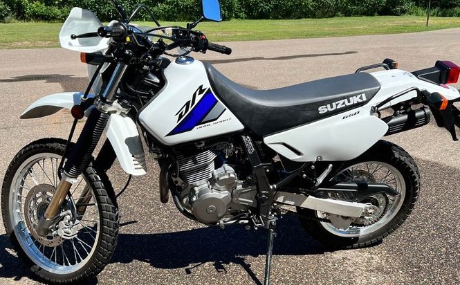The Suzuki DR650 might be the best dual sport motorcycle overall for riding on an off-road on the cheap