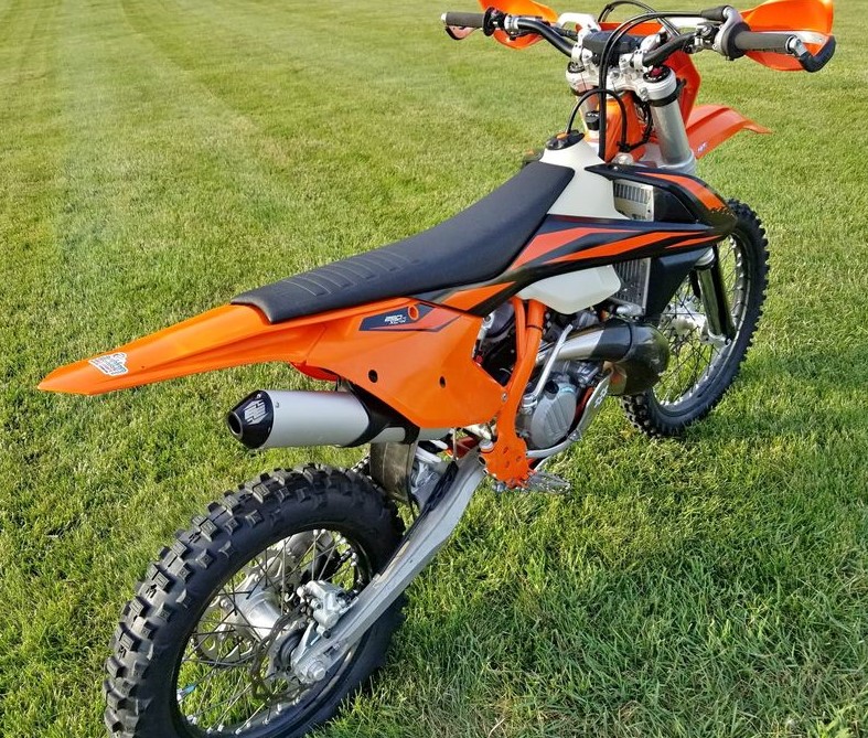 KTM 250 XCW with enduro engineering pipe guard and spark arrestor end cap