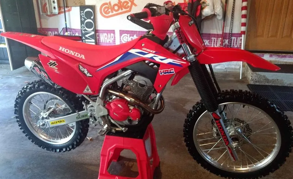 2022 Honda CRF250F with aftermarket exhaust, hand guards and case cover
