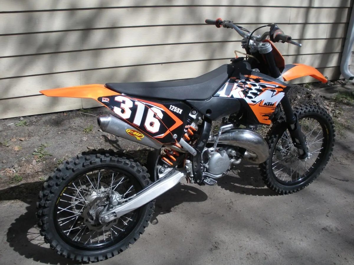 KTM 144 SX with stock pipe and FMF turbinecore spark arrestor silencer