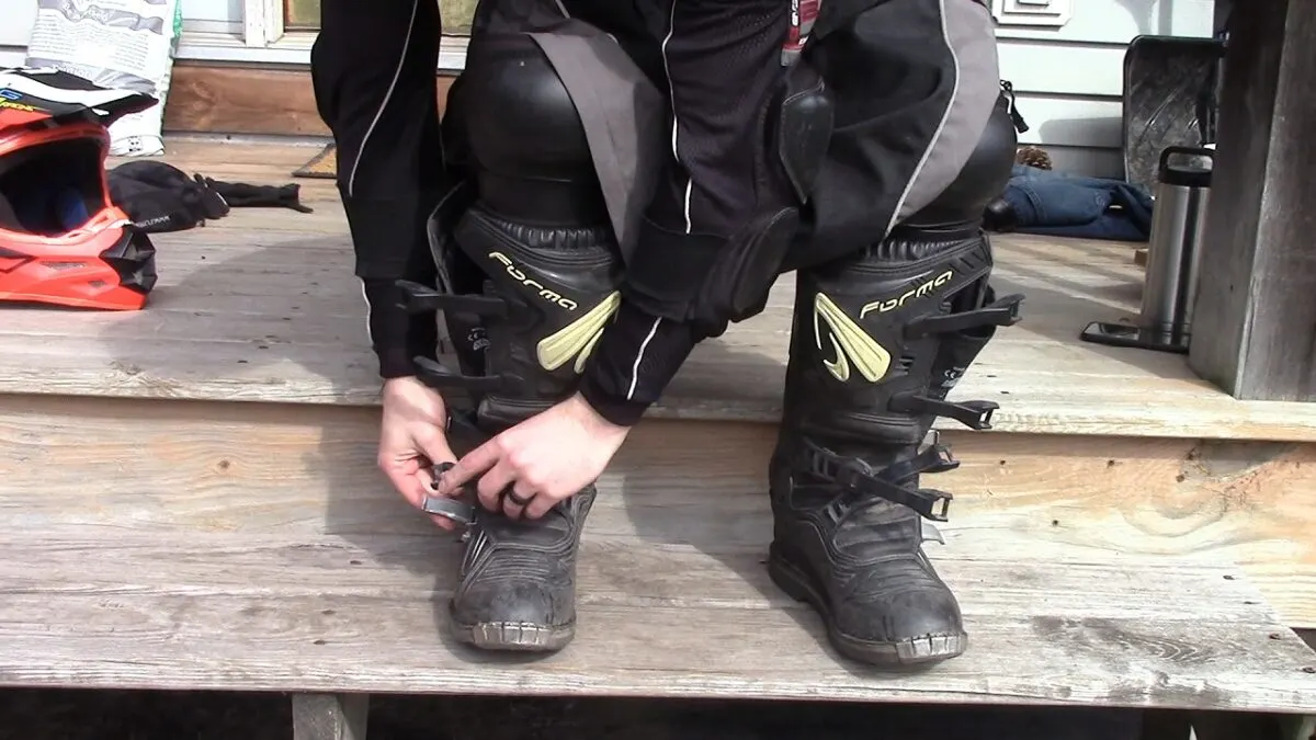 Getting Dirt Bike Riding Boots On Best Dirt Bike Gear For Kids Based On Your Budget [2024]